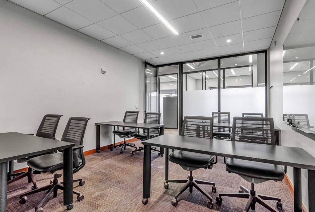 Private conference room seating up to 10 guests.