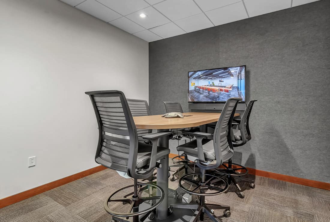 Visual Studio with built-in A/V system that seats up to five members.