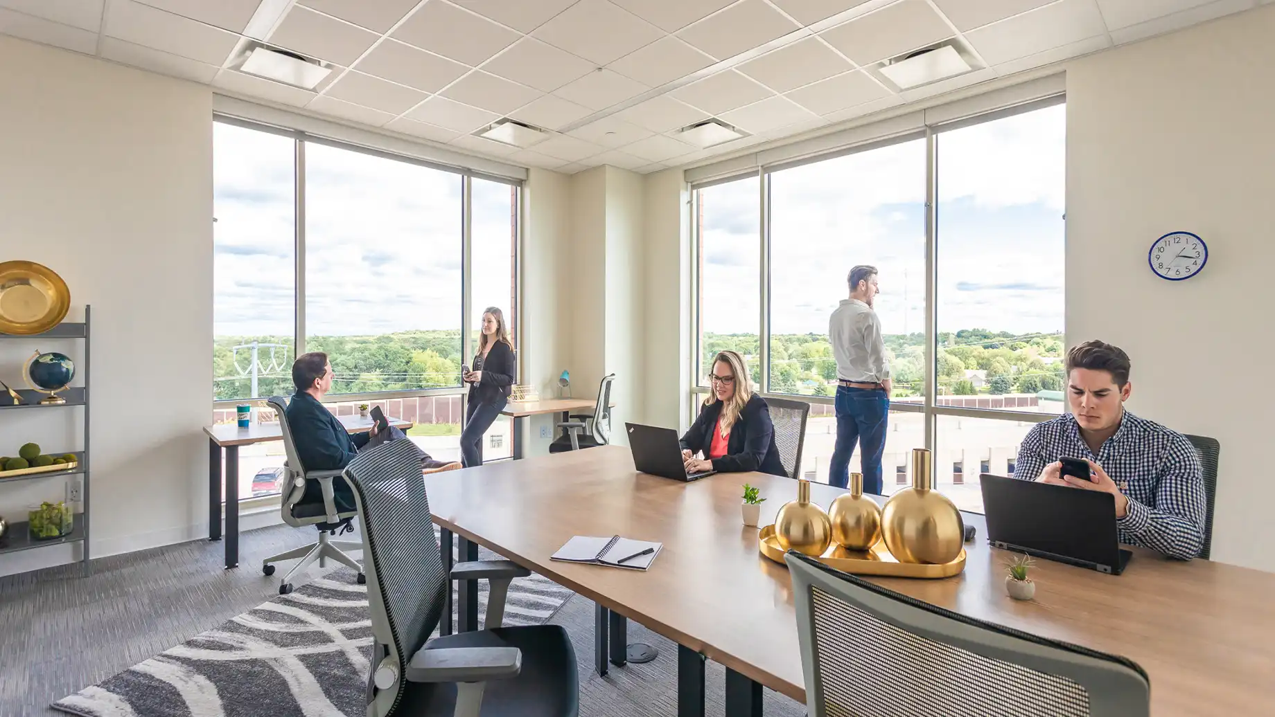 People working in an office space rental for large teams. West Madison Private Office & Coworking Space