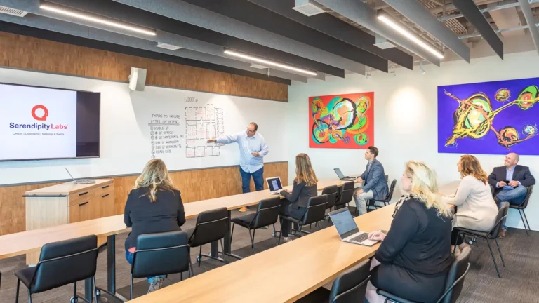 Open Coworking area with members working independently throughout the space. West Madison Private Office & Coworking Space