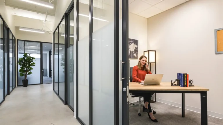 Woman working independently in private one person office.