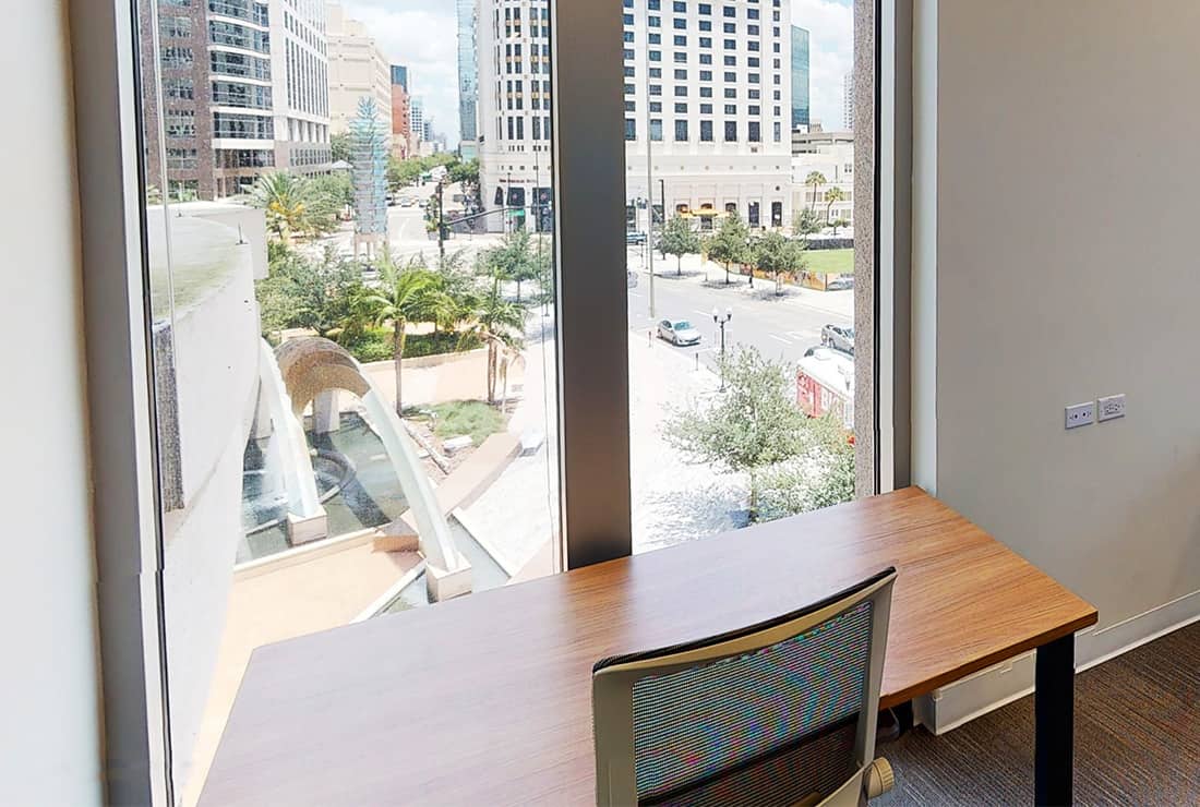 View of private one person office with views of Downtown.