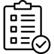 A person sits at a desk in Brentwood, holding their head in frustration, surrounded by tall stacks of papers and books, conveying stress or overwhelm with work or study.