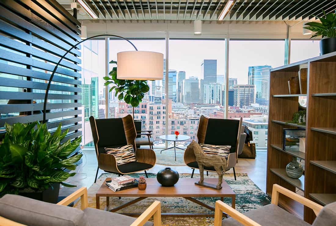 Cozy seating area in Coworking space with a view of the city.