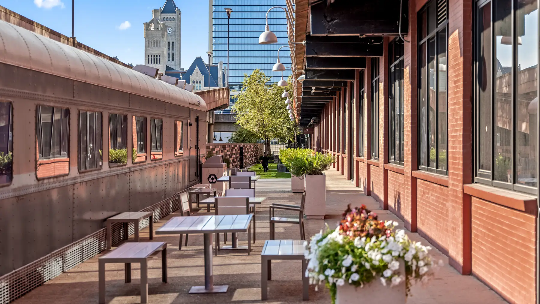 Outdoor eating next to the train. The Gulch Nashville Office Space & Coworking Space