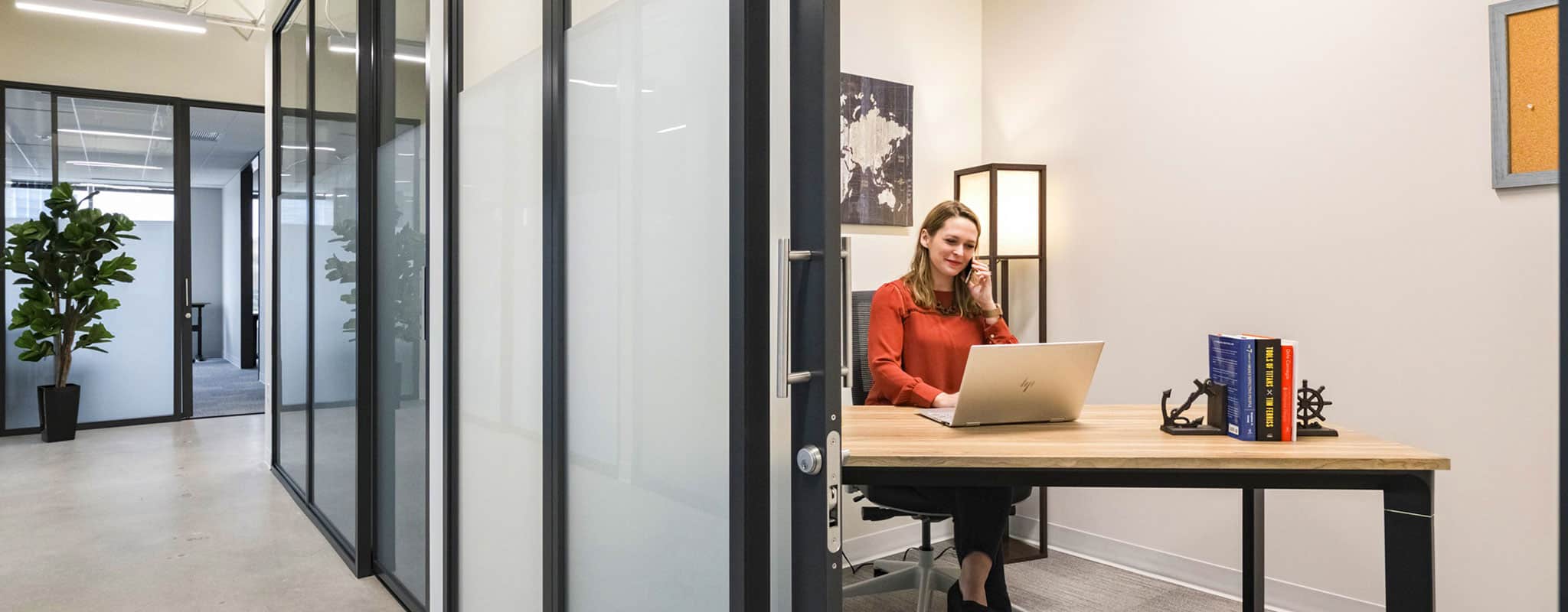 Woman working independently in private one person office.