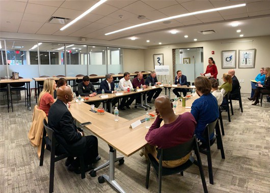 Event being hosted in the Ideation Studio with member sitting in boardroom style